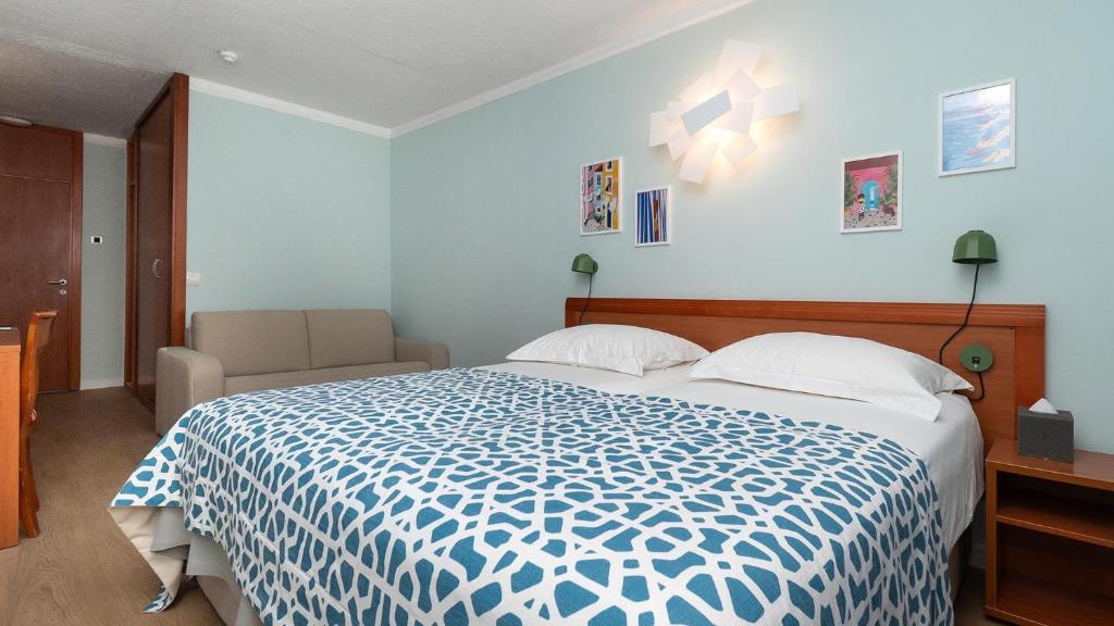 Krevet ili kreveti u jedinici u objektu Amadria Park Beach Hotel Niko