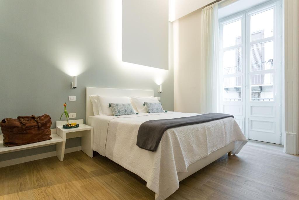 Una cama o camas en una habitación de Bellaroto Suite & SPA