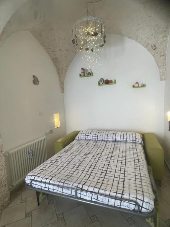 A bed or beds in a room at Le Alcove del Leopardi