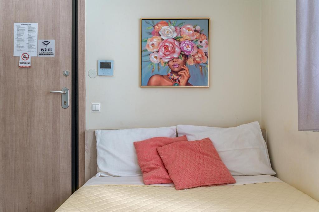 A bed or beds in a room at Elvita Apartments 3