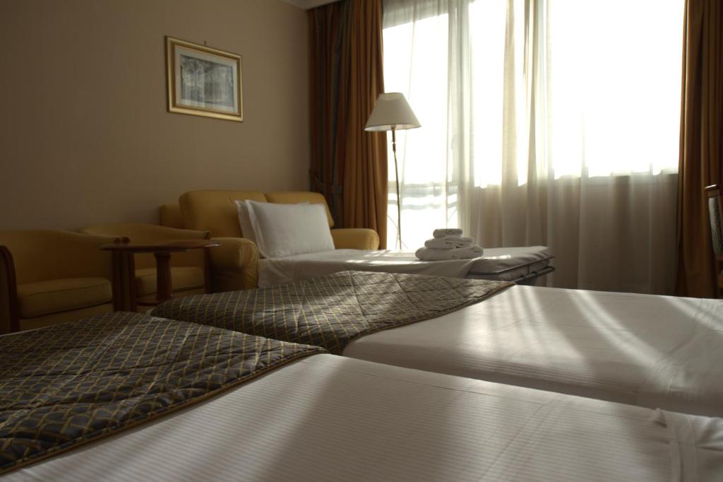Postel nebo postele na pokoji v ubytování Hotel Roma Aurelia Antica