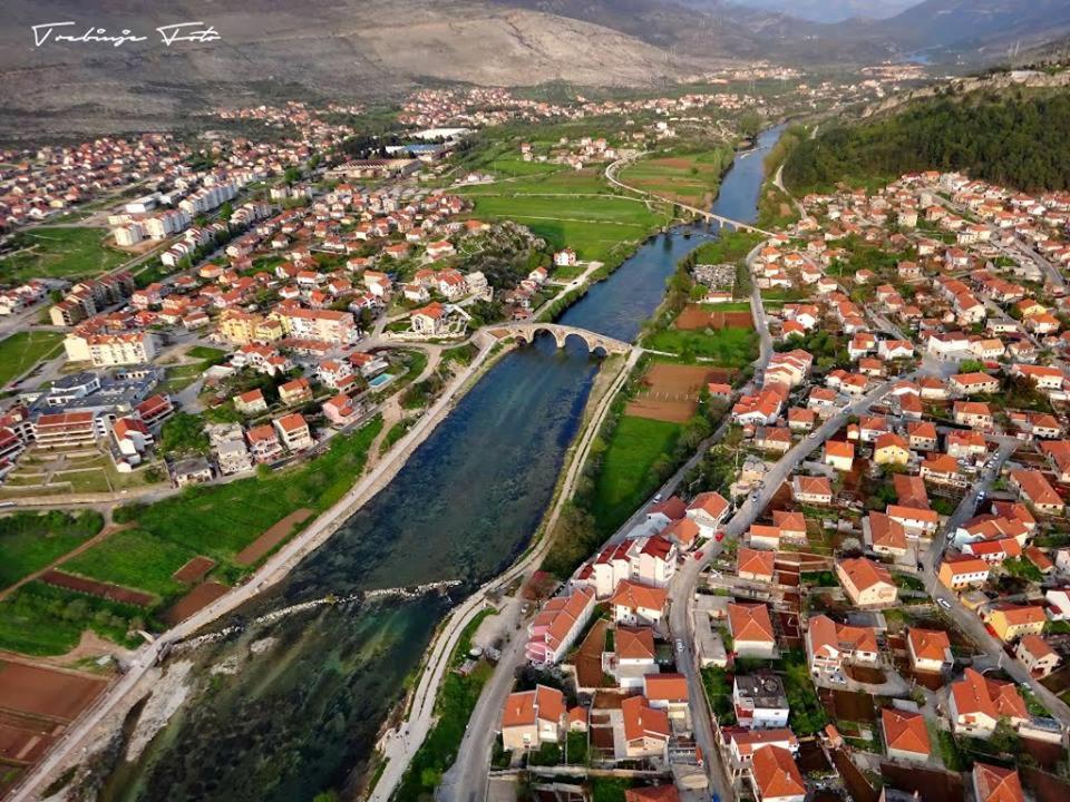 an aerial view of a town next to a river at Apartman CENTAR in Trebinje