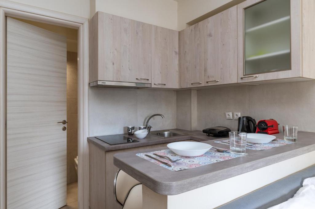 A kitchen or kitchenette at Elvita Apartments 3