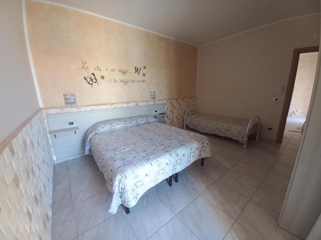 a bedroom with a bed in a room at B&B Letizia in Marina di Lizzano