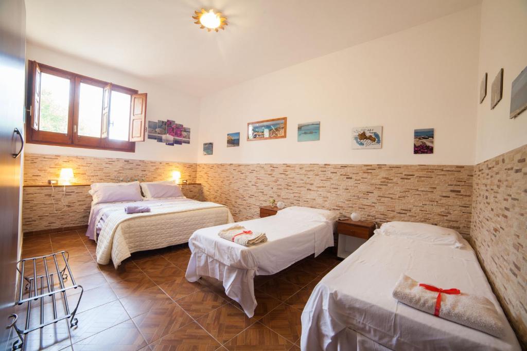 Postel nebo postele na pokoji v ubytování villa amodeo