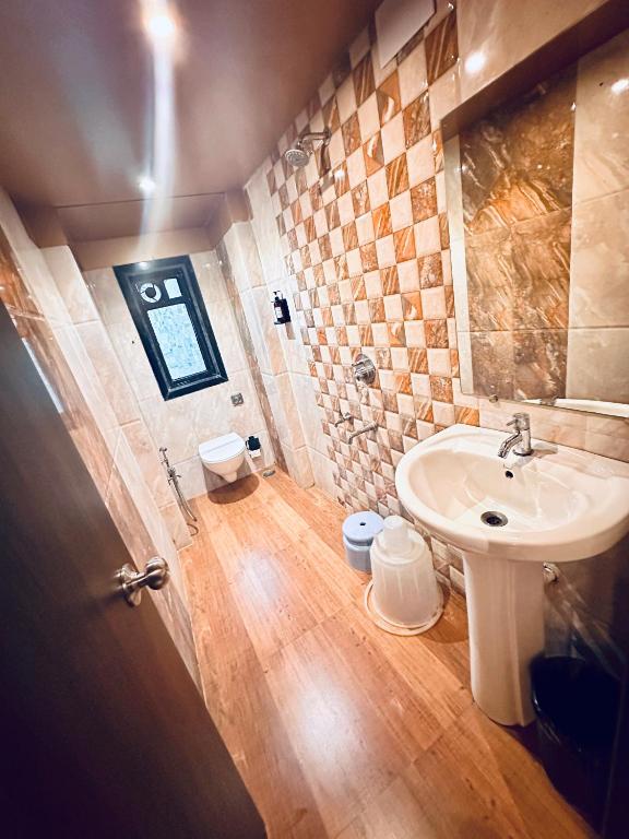 Koupelna v ubytování Saibaba International Hotel