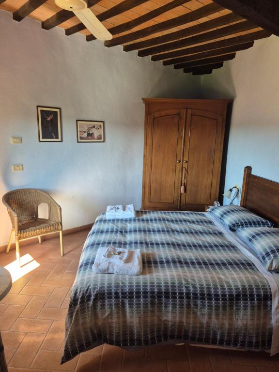 Postel nebo postele na pokoji v ubytování Ghigo La Locanda di Torquato