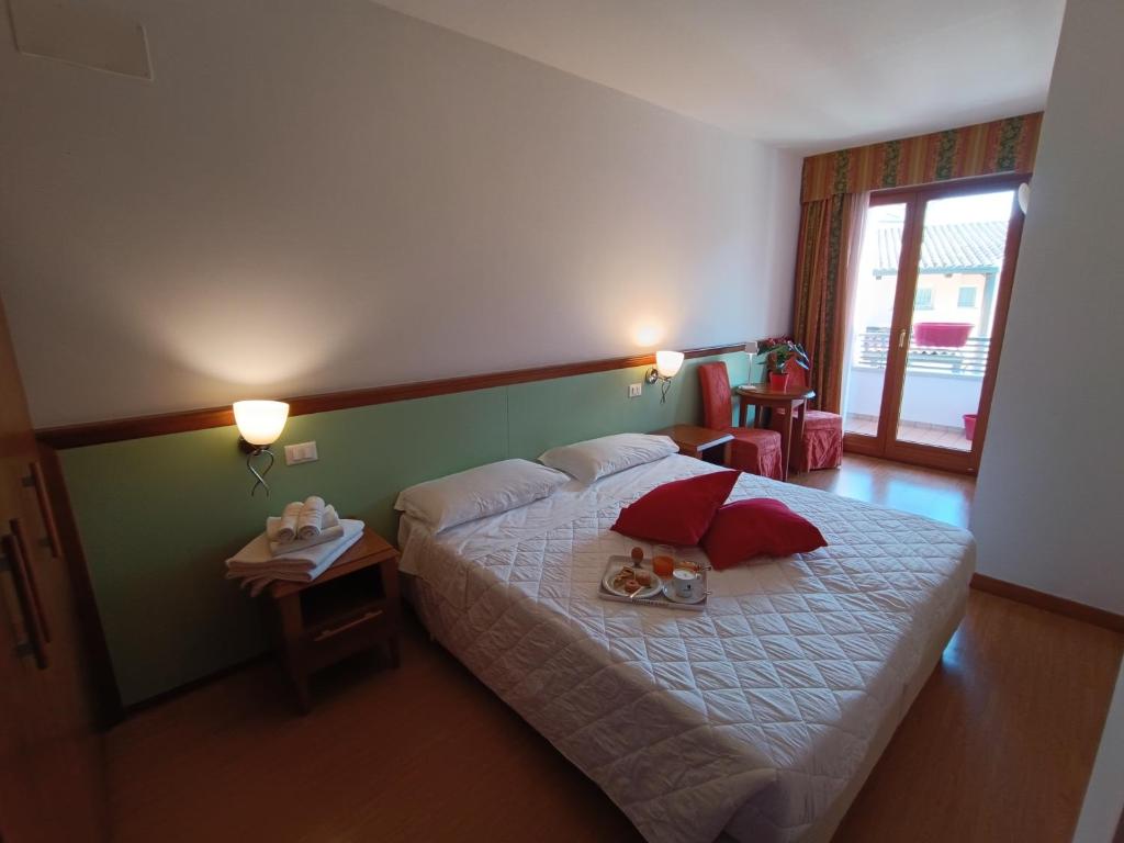 Postel nebo postele na pokoji v ubytování Hotel Il Guscio