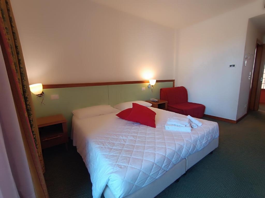 Postel nebo postele na pokoji v ubytování Hotel Il Guscio