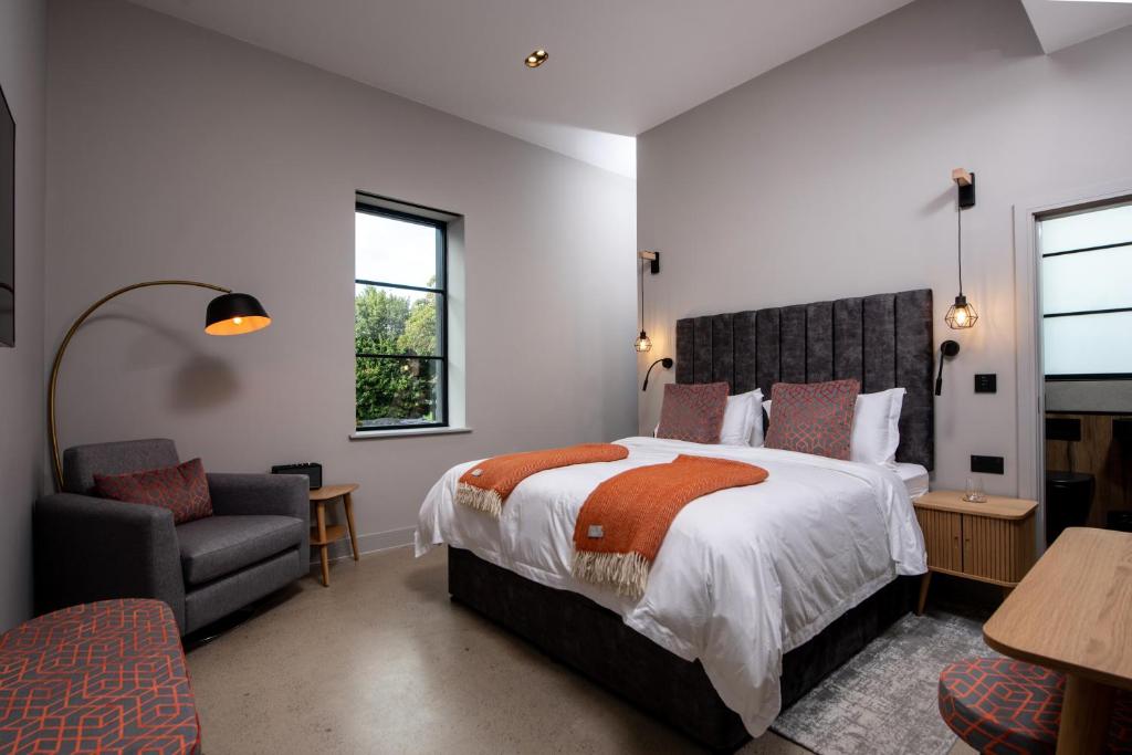 Postel nebo postele na pokoji v ubytování Montgomery House Apart-Hotel