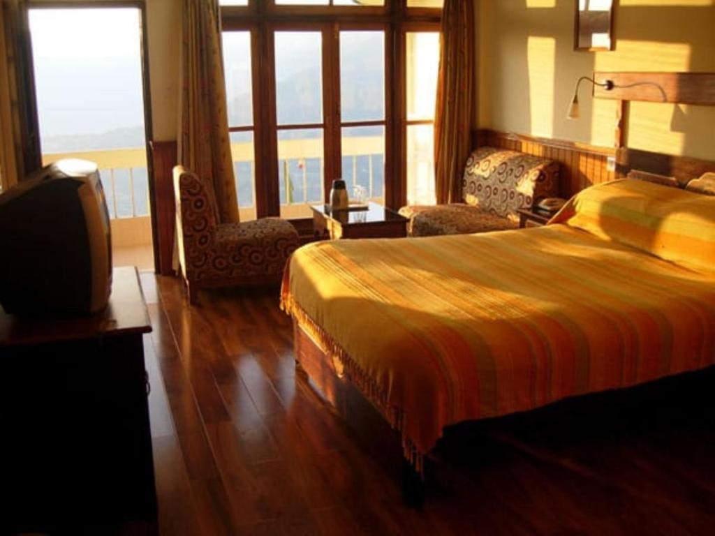 Postel nebo postele na pokoji v ubytování Sonam Delek Gangtok Tibet Road