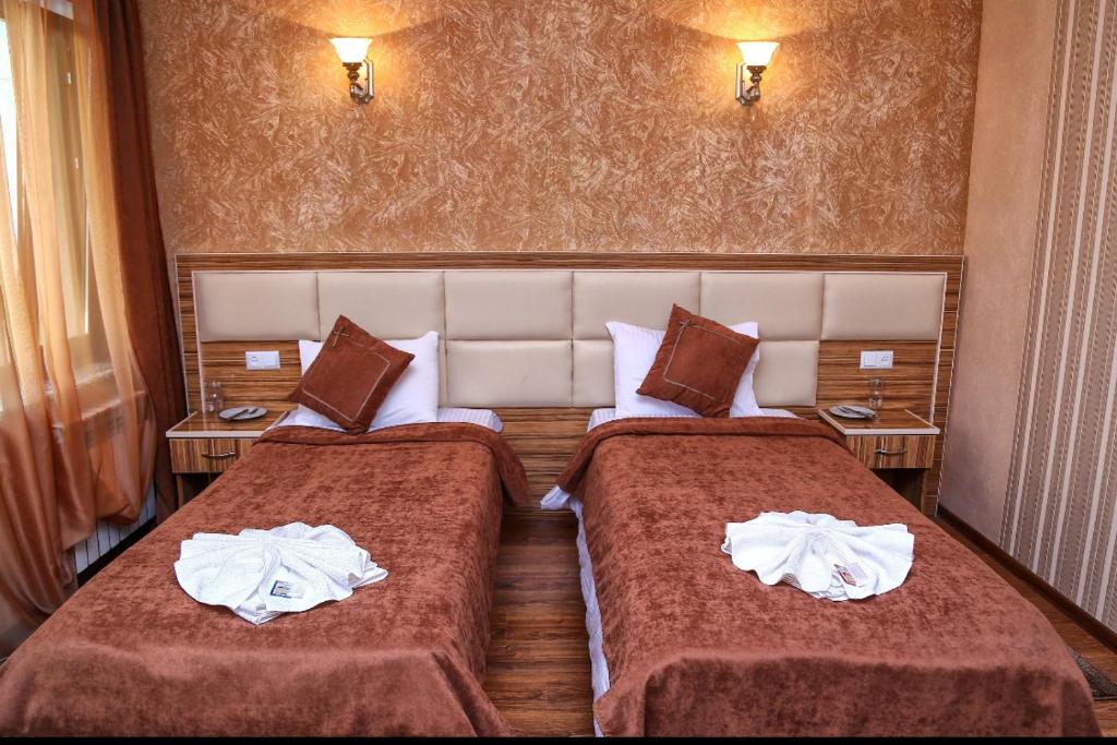 Postel nebo postele na pokoji v ubytování AVAGYAN'S Hotel-restaurant