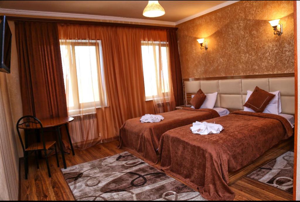 Postel nebo postele na pokoji v ubytování AVAGYAN'S Hotel-restaurant