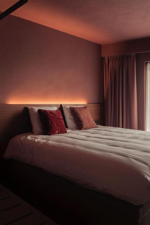 Postel nebo postele na pokoji v ubytování Hostellerie Kemmelberg