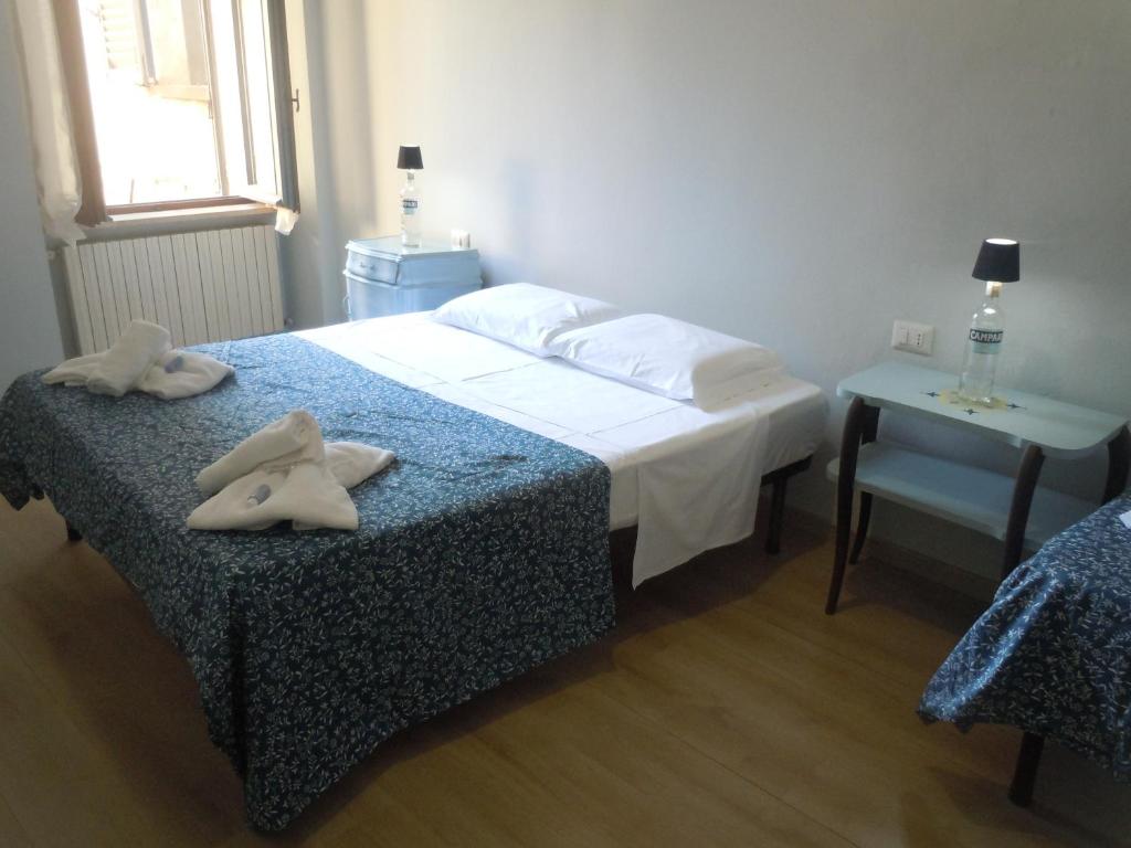 Postel nebo postele na pokoji v ubytování MARTINI e CAMPARI