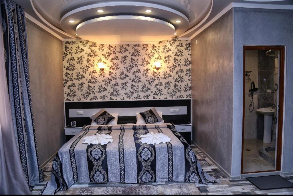 Postel nebo postele na pokoji v ubytování AVAGYAN'S Hotel-restaurant