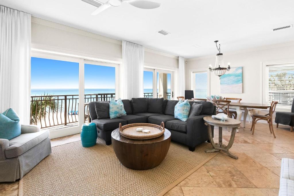 a living room with a couch and a table at Five Star in Inlet Beach