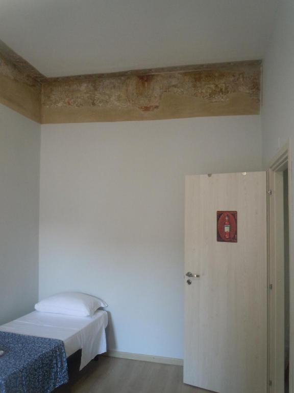Postel nebo postele na pokoji v ubytování MARTINI e CAMPARI