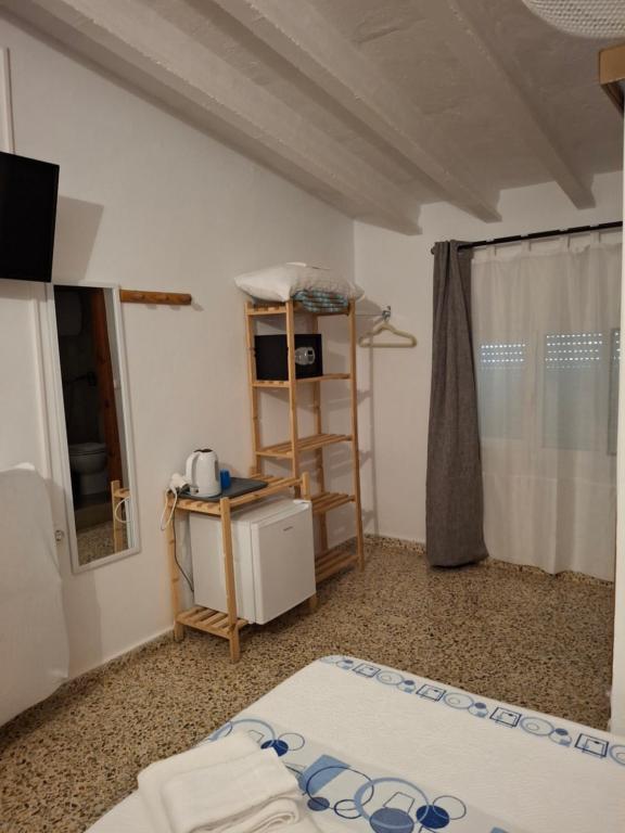 Postel nebo postele na pokoji v ubytování Hostal Pepe