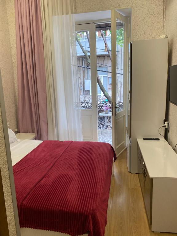 Postel nebo postele na pokoji v ubytování Cozy Rooms Tbilisi