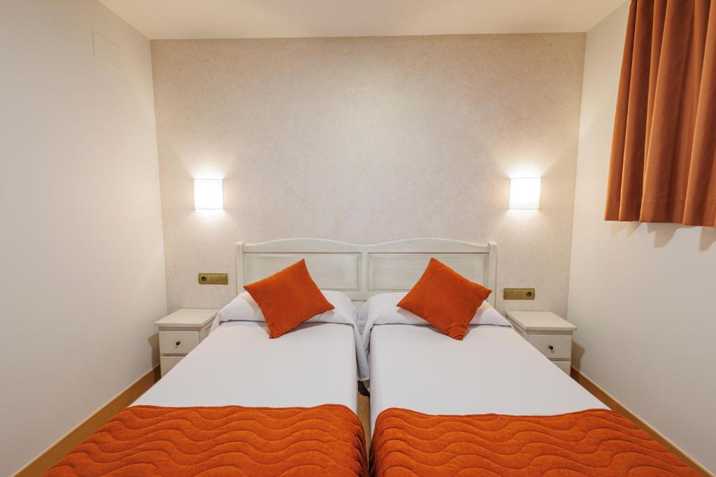 Postel nebo postele na pokoji v ubytování Hotel Pattaya