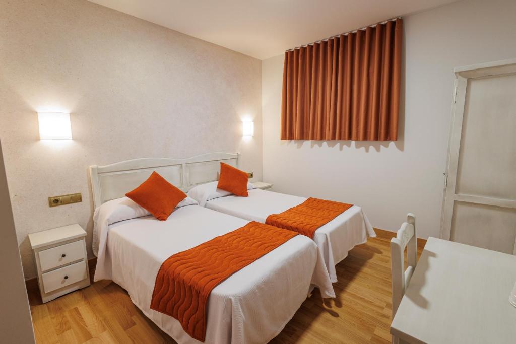 Postel nebo postele na pokoji v ubytování Hotel Pattaya