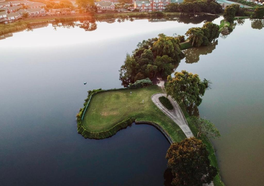 an island in the middle of a body of water at Cosy Urban Apartment in Durban