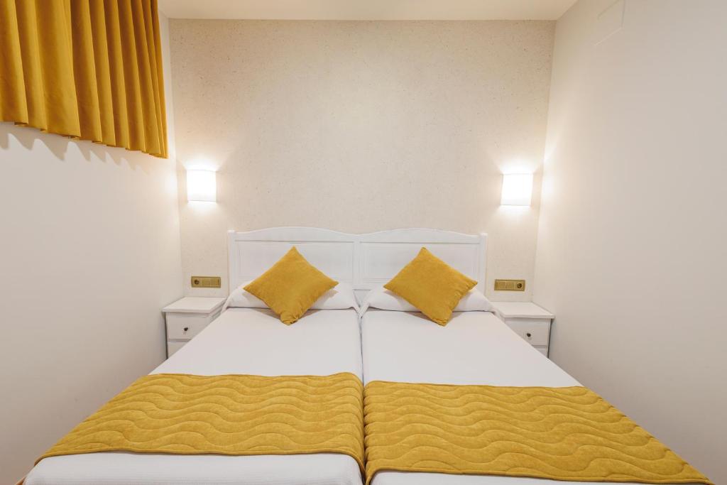 Postel nebo postele na pokoji v ubytování Hotel Pattaya