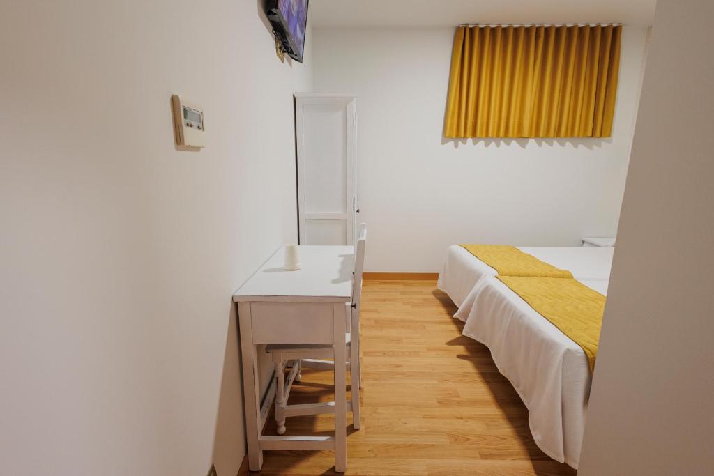 Postel nebo postele na pokoji v ubytování Hotel Pattaya