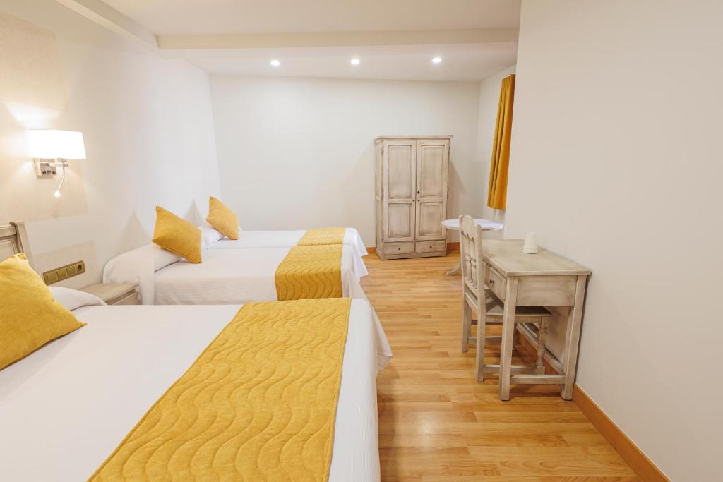 Postel nebo postele na pokoji v ubytování Hotel Pattaya
