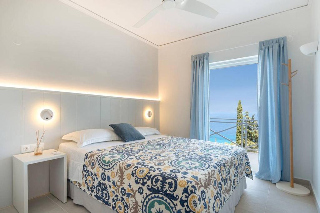 A bed or beds in a room at Myrto Homes Lefkada Agios Nikitas Greece