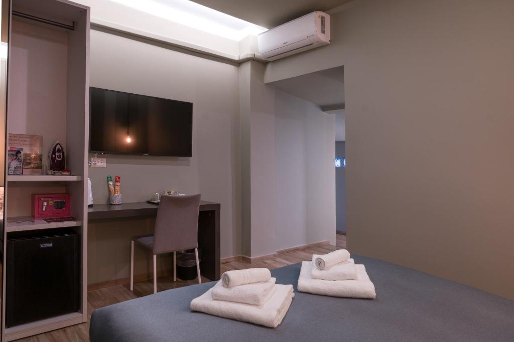 Postel nebo postele na pokoji v ubytování GOGO` Petit Hotel