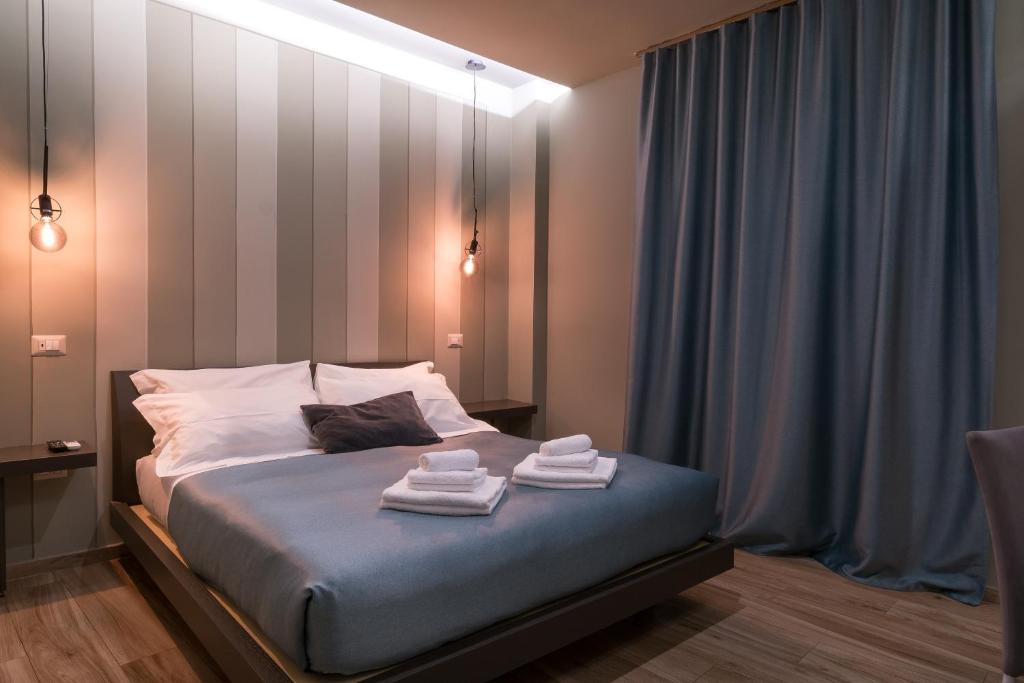 Postel nebo postele na pokoji v ubytování GOGO` Petit Hotel