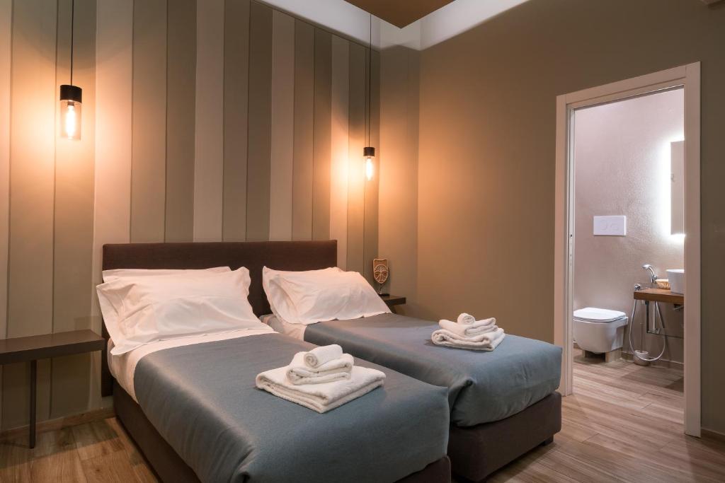 Postel nebo postele na pokoji v ubytování GOGO` Petit Hotel
