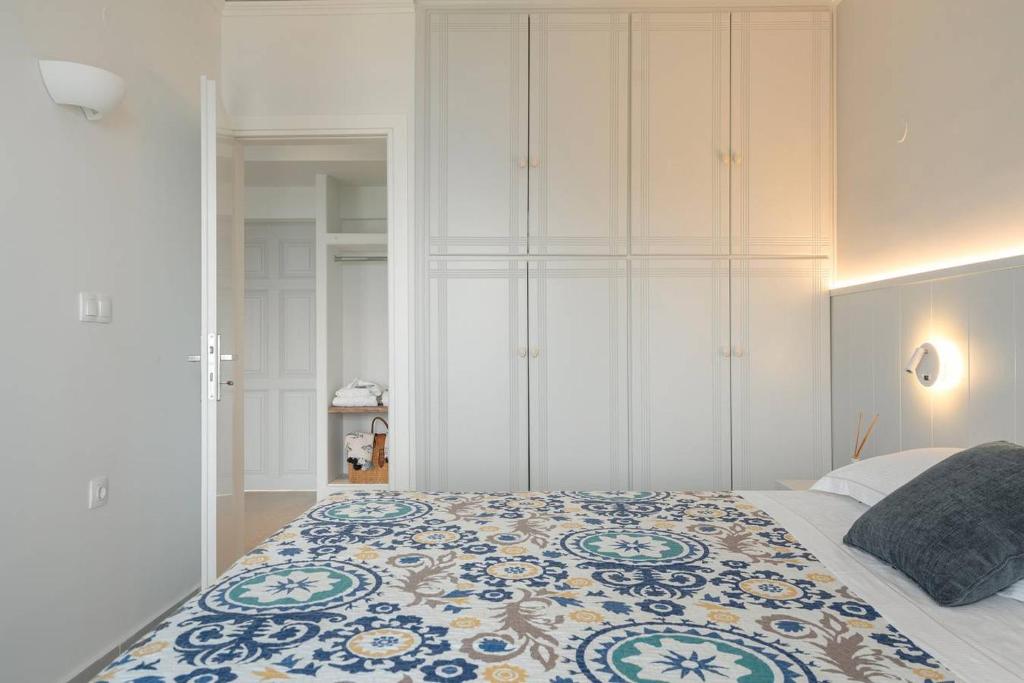 A bed or beds in a room at Myrto Homes Lefkada Agios Nikitas Greece