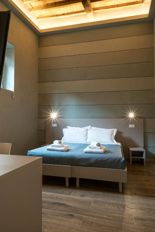 Postel nebo postele na pokoji v ubytování GOGO` Petit Hotel