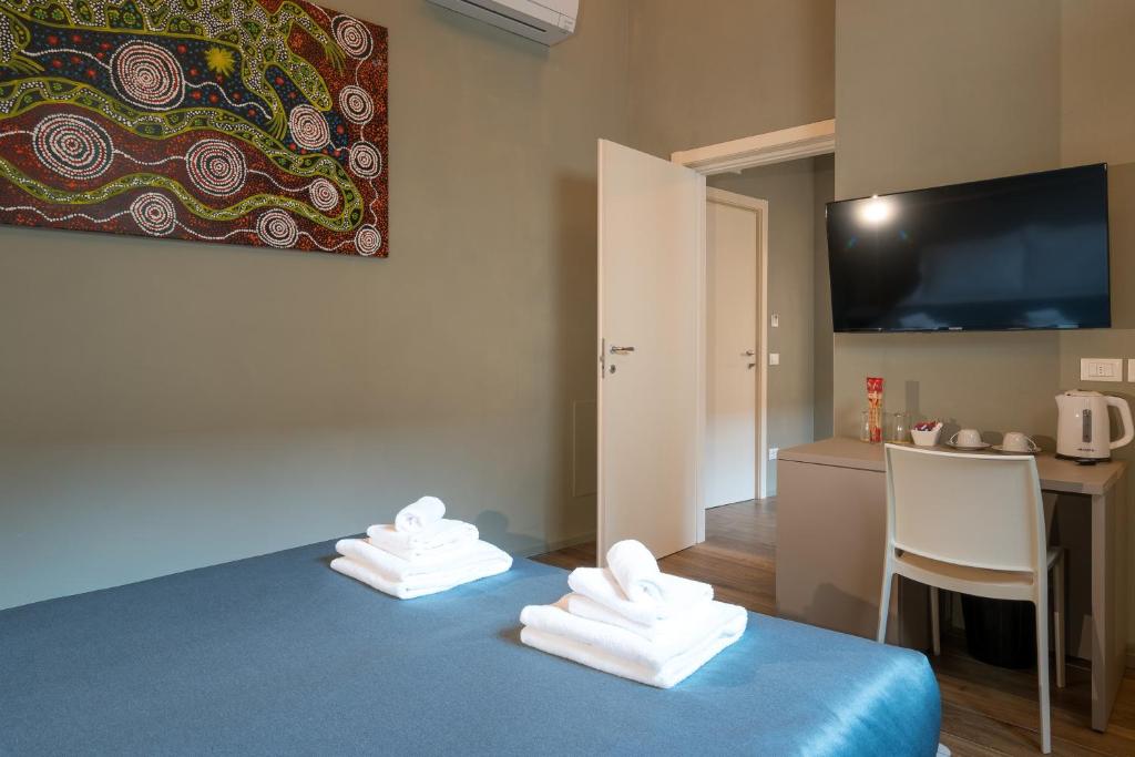 Postel nebo postele na pokoji v ubytování GOGO` Petit Hotel