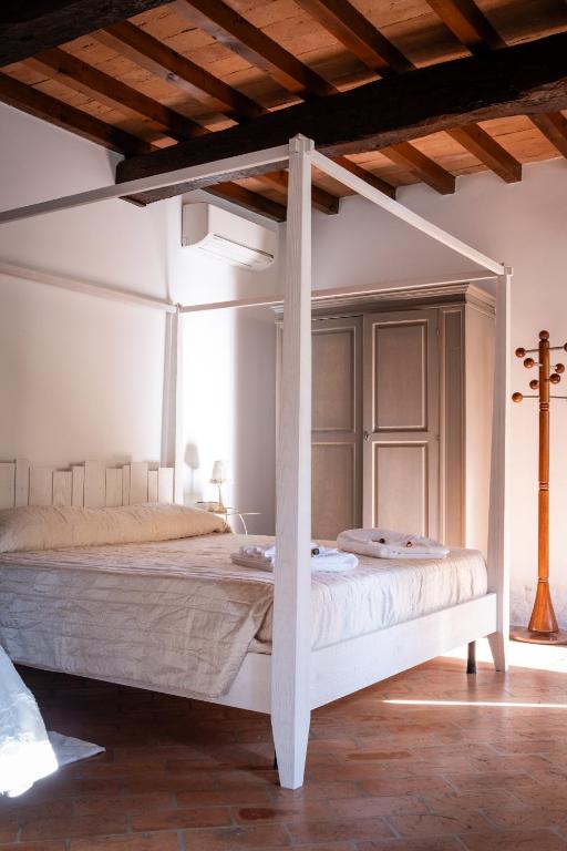 Postel nebo postele na pokoji v ubytování Agriturismo Corte Capiluppia
