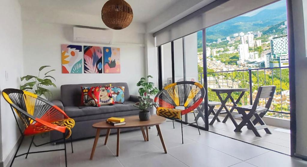 a living room with a couch and chairs and a table at Cosy Mountain View 3BR Apartment, Prime Location! in Floridablanca