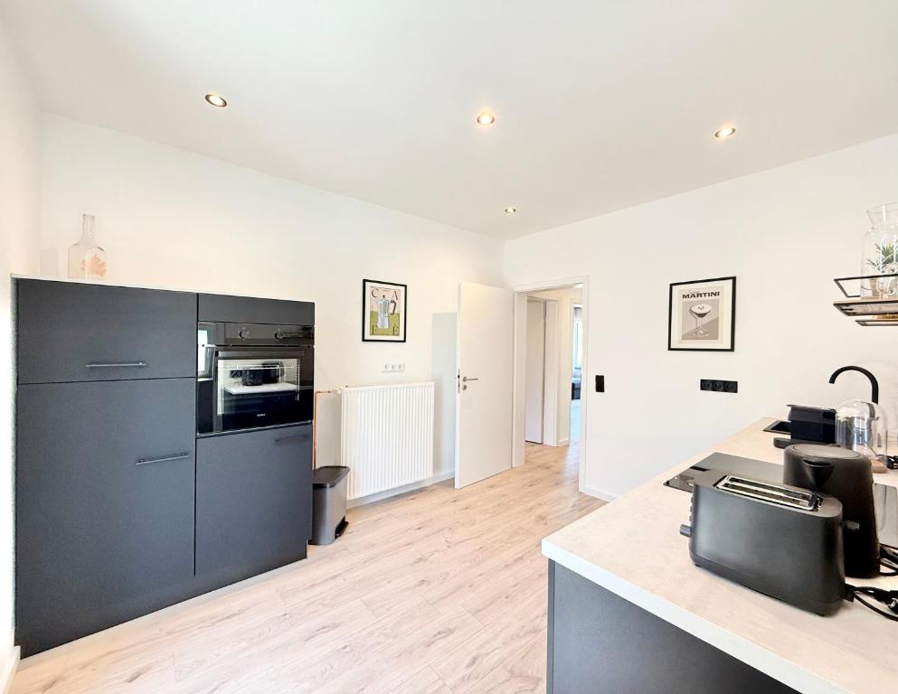 Kuchyň nebo kuchyňský kout v ubytování Hochwertig saniertes Apartment "Jana", direkt am Ruhrtalradweg, Arnsberg - Neheim