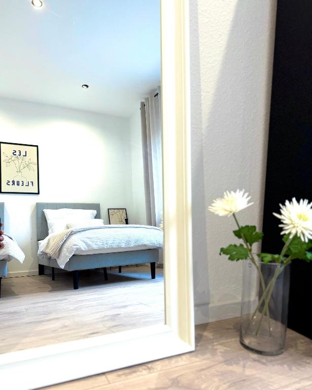 Postel nebo postele na pokoji v ubytování Hochwertig saniertes Apartment "Jana", direkt am Ruhrtalradweg, Arnsberg - Neheim