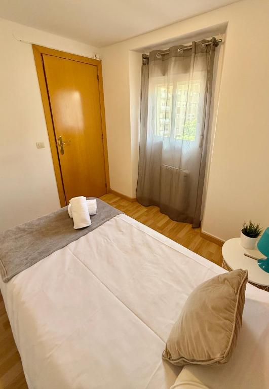 Postel nebo postele na pokoji v ubytování Apartamento Ramon Pignatelli