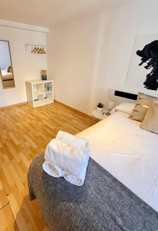 Postel nebo postele na pokoji v ubytování Apartamento Ramon Pignatelli