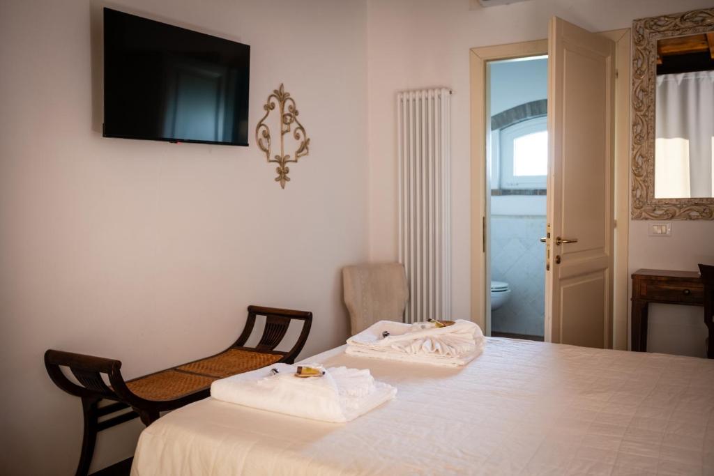 Postel nebo postele na pokoji v ubytování Agriturismo Corte Capiluppia