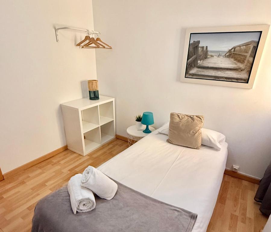 Postel nebo postele na pokoji v ubytování Apartamento Ramon Pignatelli