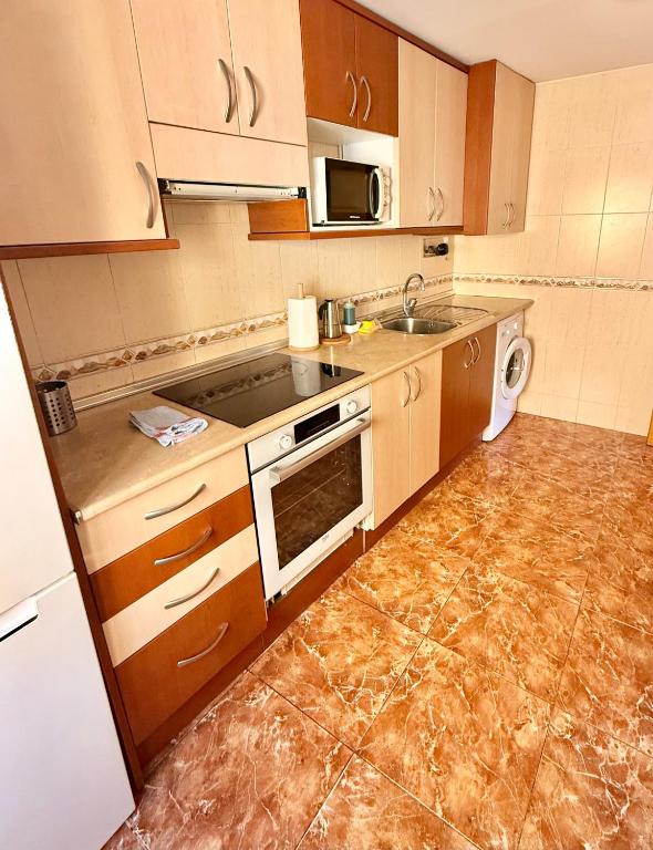 Kuchyň nebo kuchyňský kout v ubytování Apartamento Ramon Pignatelli