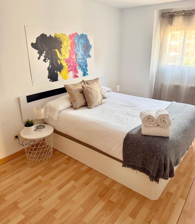 Postel nebo postele na pokoji v ubytování Apartamento Ramon Pignatelli