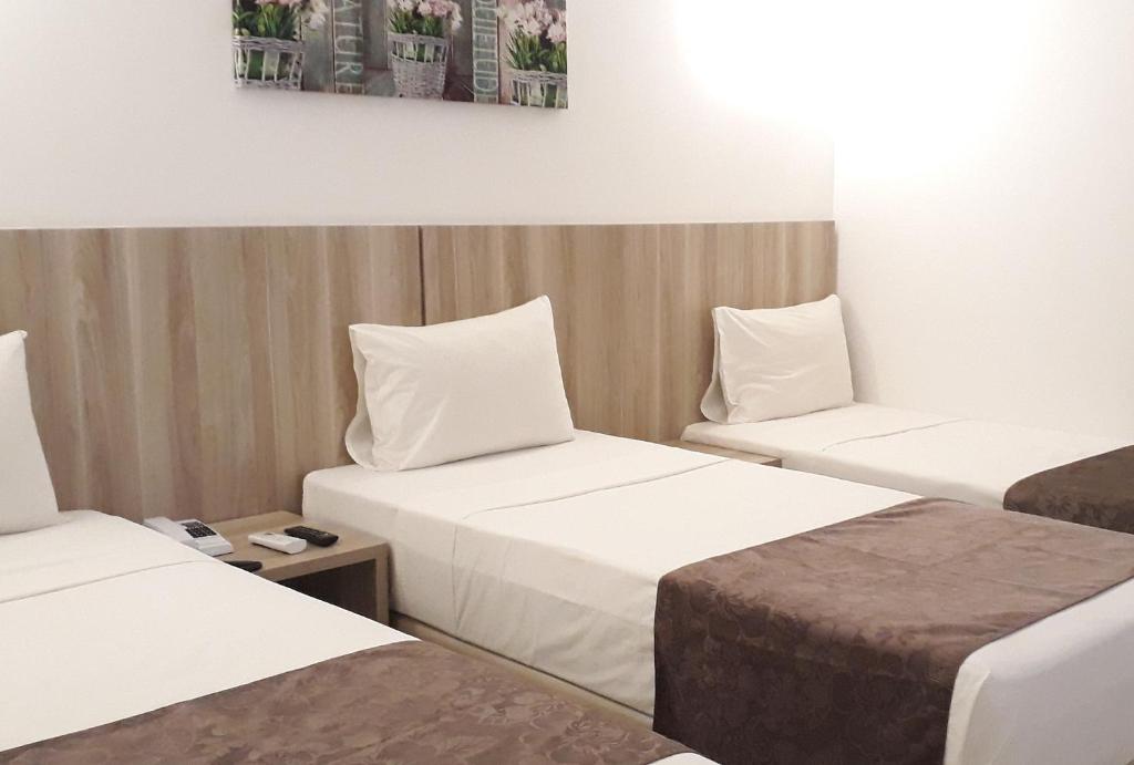 Postel nebo postele na pokoji v ubytování Pena Branca Hotel e Eventos