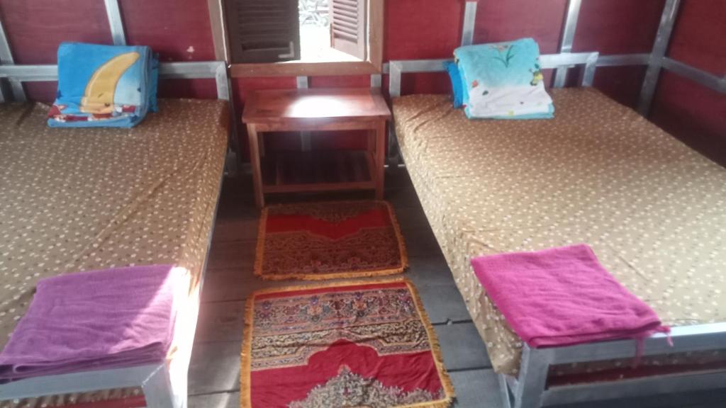 Postel nebo postele na pokoji v ubytování Meta Homestay