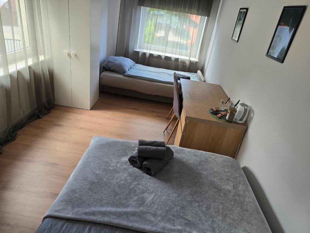 Postel nebo postele na pokoji v ubytování Południe Wrocławia